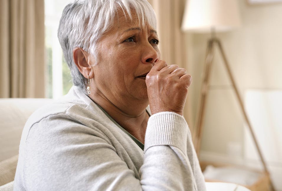 elderly woman coughing
