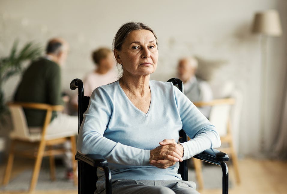 unhappy woman in a wheelchair