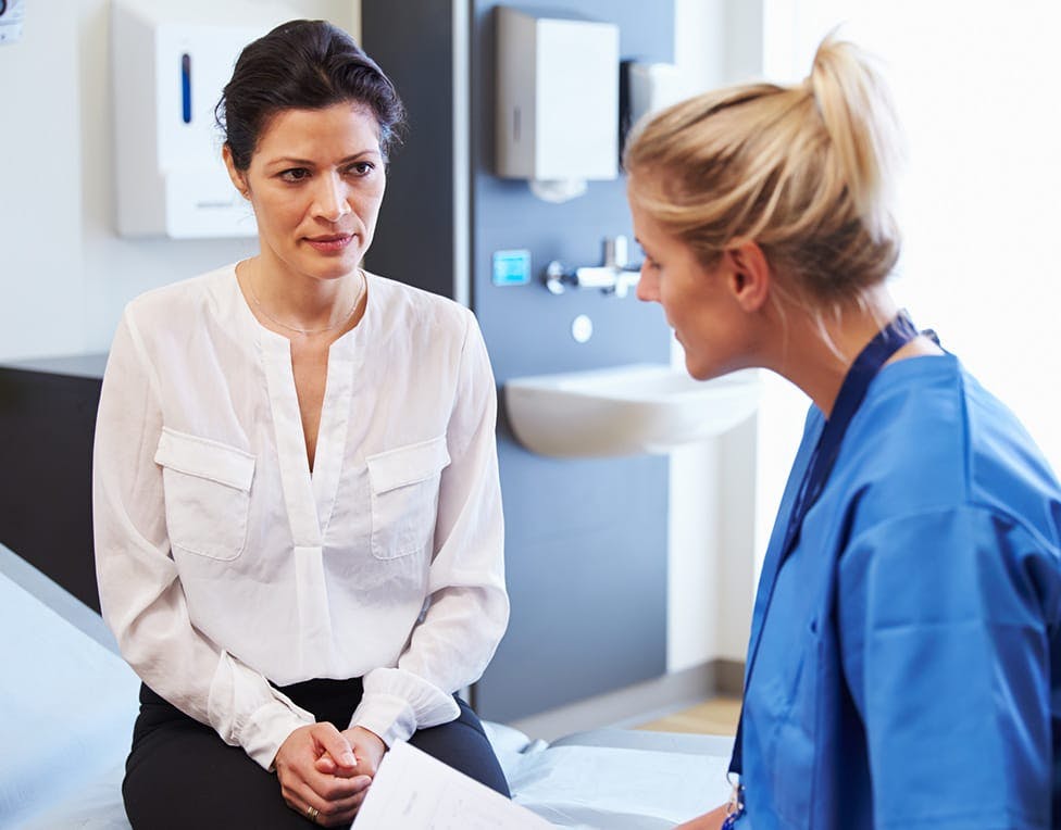 Woman talking to a doctor