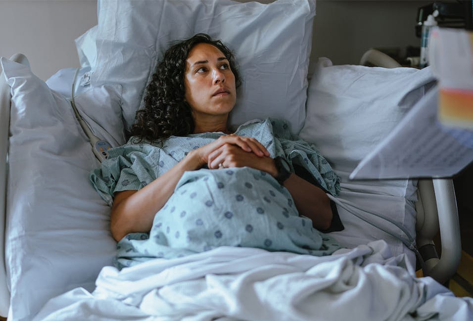 Pregnant woman in a hospital bed