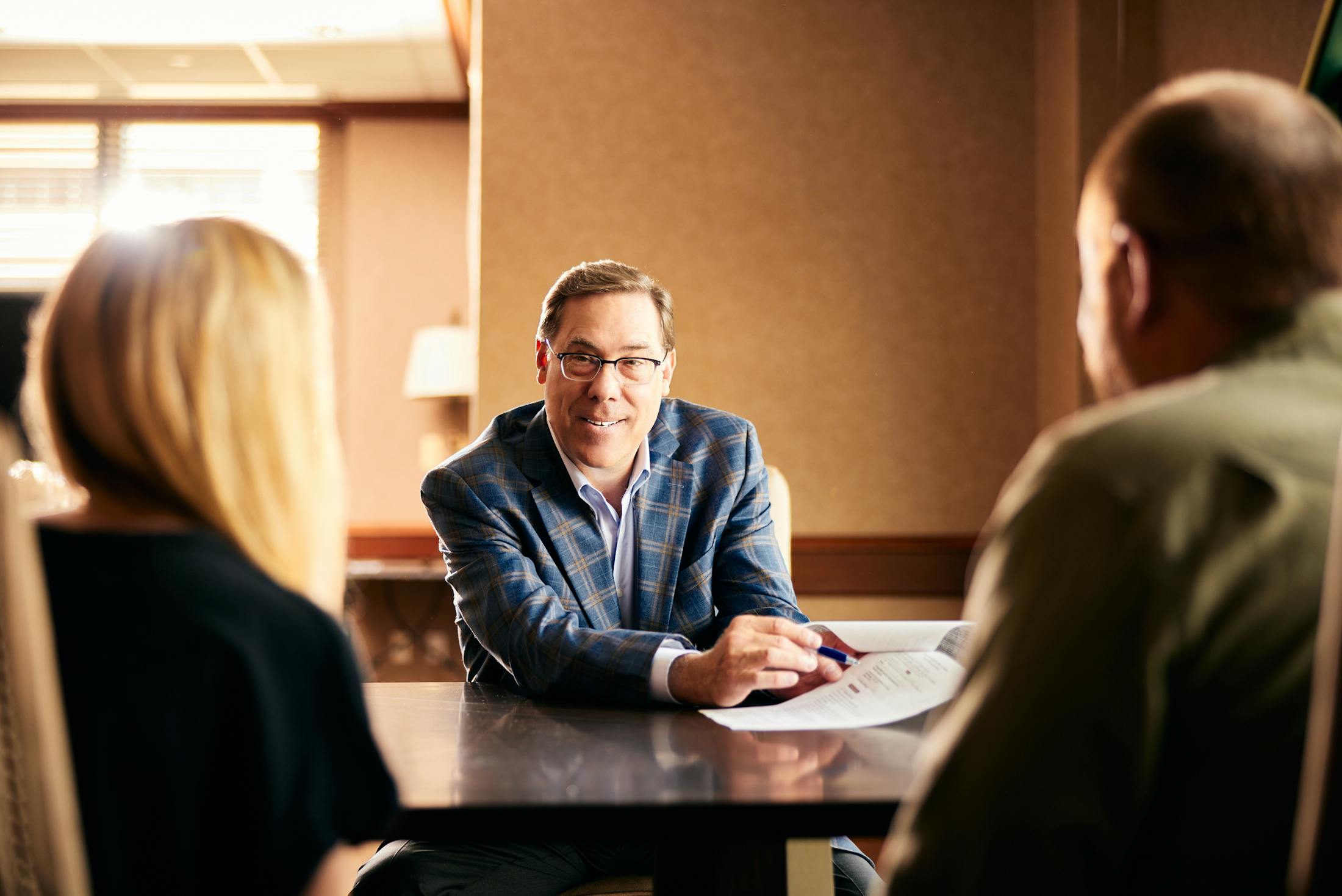 Glenn Cunningham working with two clients