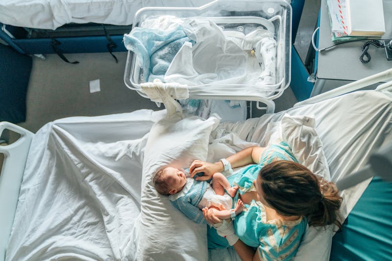 A woman in hospital holding her baby