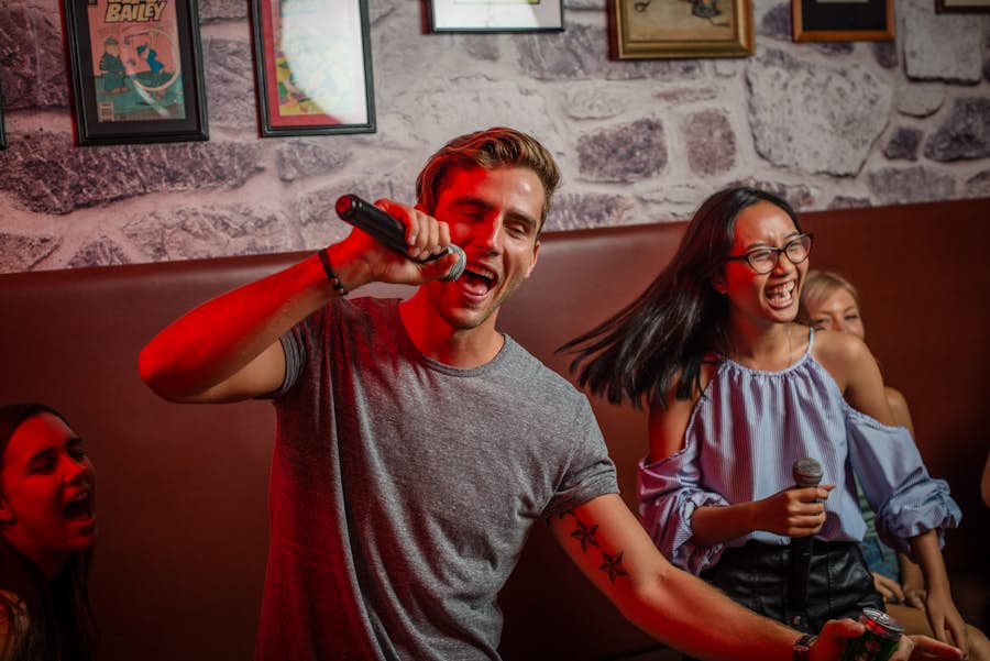 Male and female singing karaoke