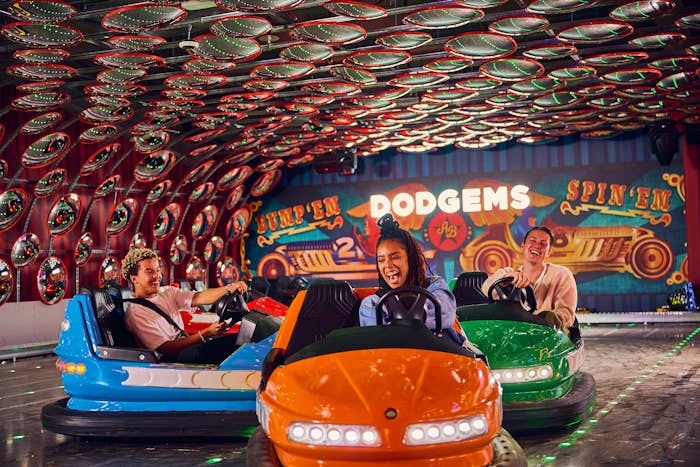 Group of friends riding in bumper cars