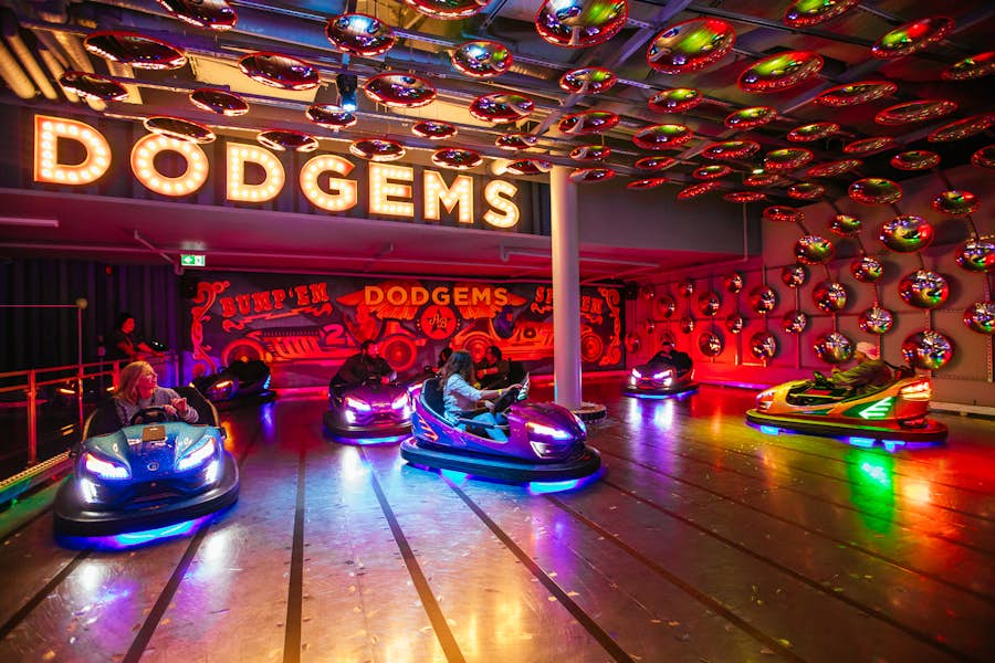6 people riding in bumper cars