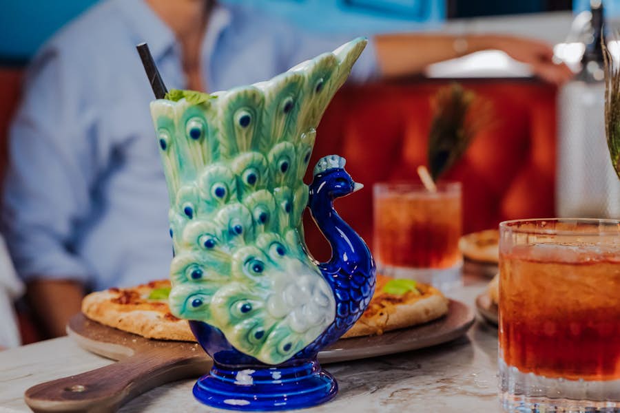 Cocktail in a peacock shaped glass