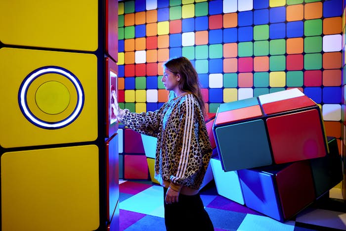 Girl playing in Hijinx cube room