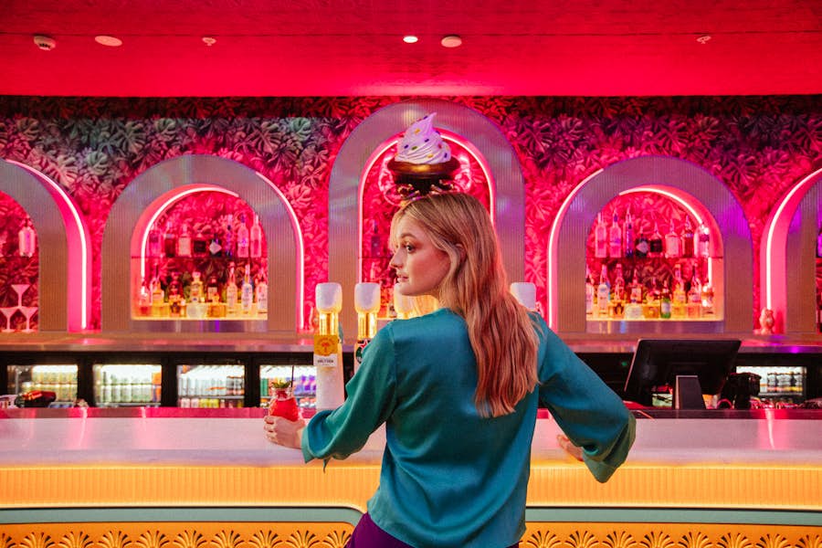 Girl standing in front of Hijinx Hotel bar