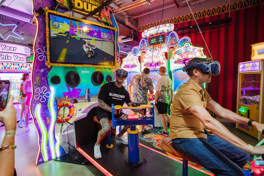 Two guys playing Spongebob VR arcade game at Archie Brother in Surfers Paradise