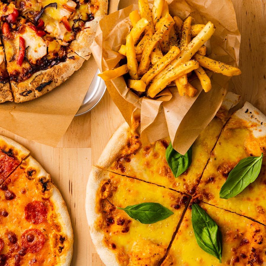pizza and fries on a table