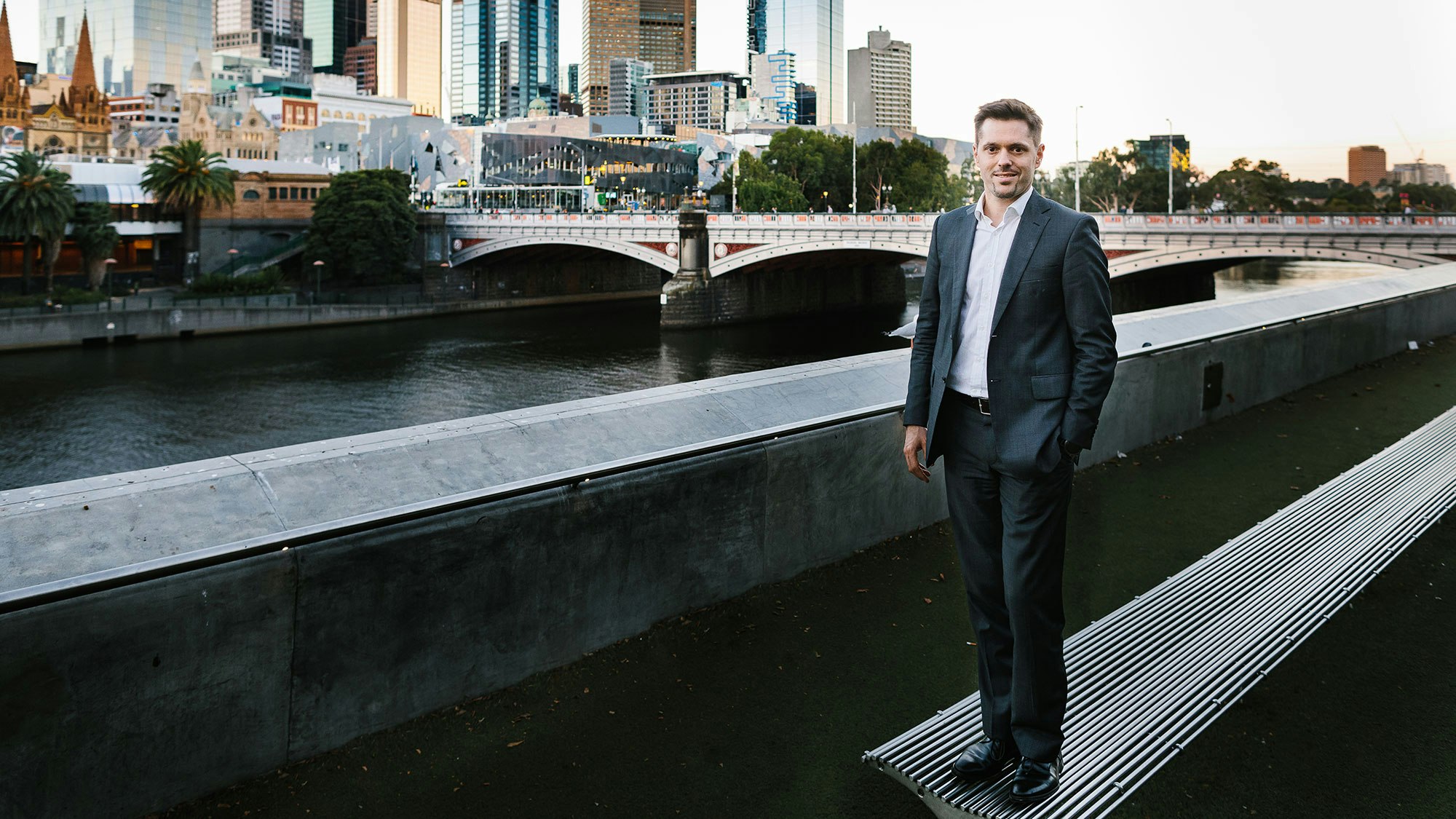 Bernard in a suit in an urban setting