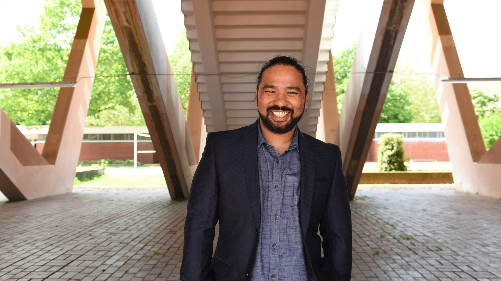 Person in suit smiling