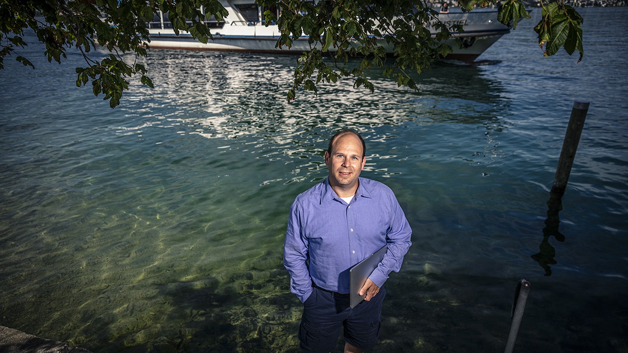 David standing by the lake