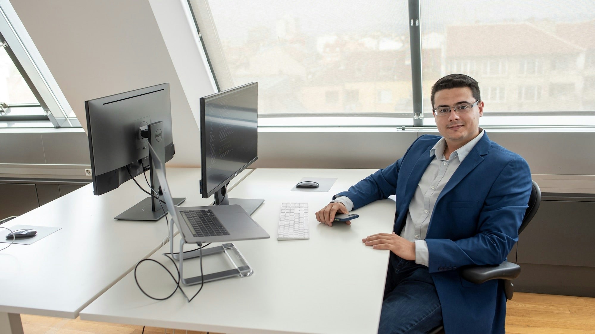 Petrov sitting by his desk behind the computer