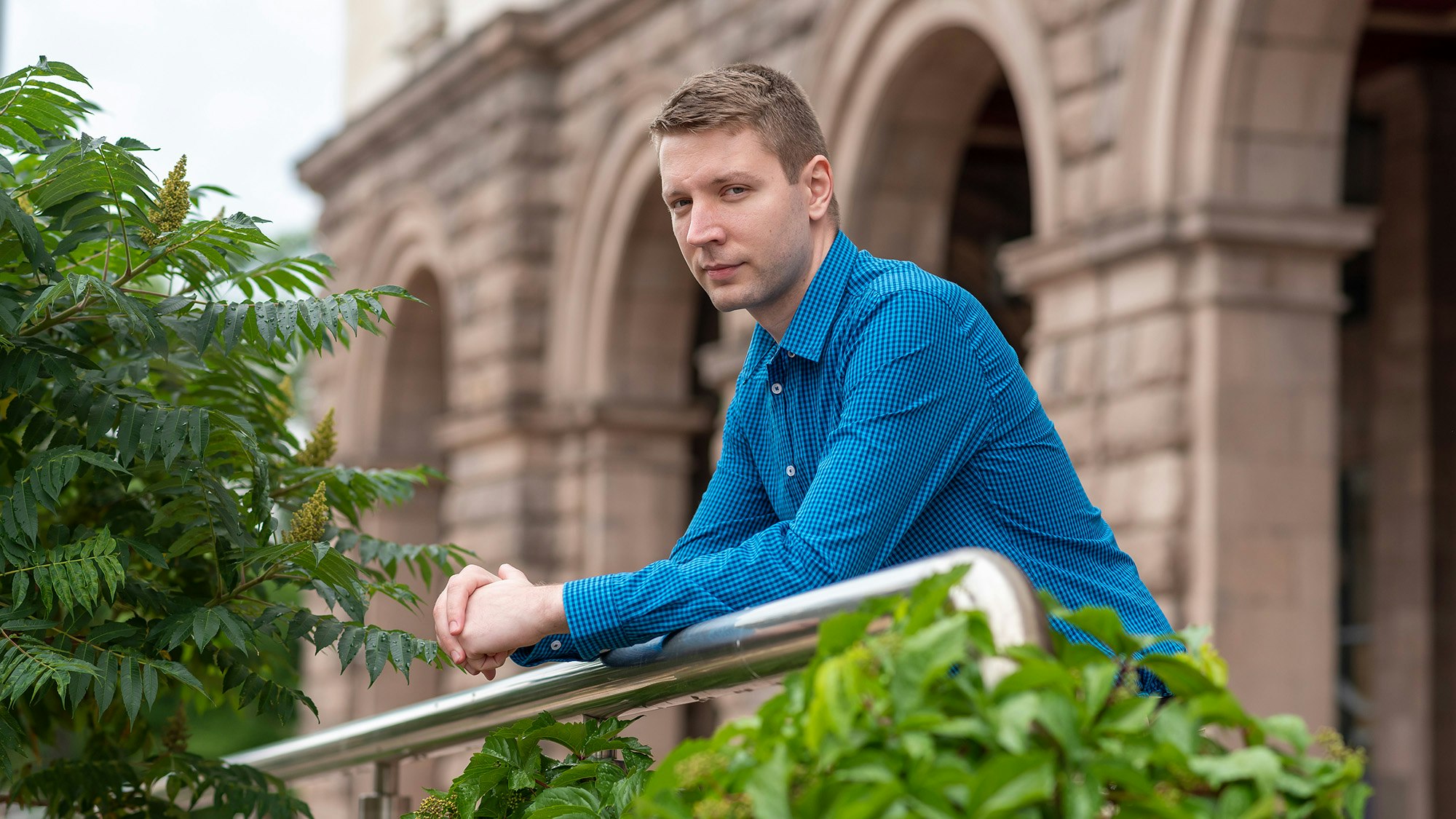 Vasilev leaning on railing