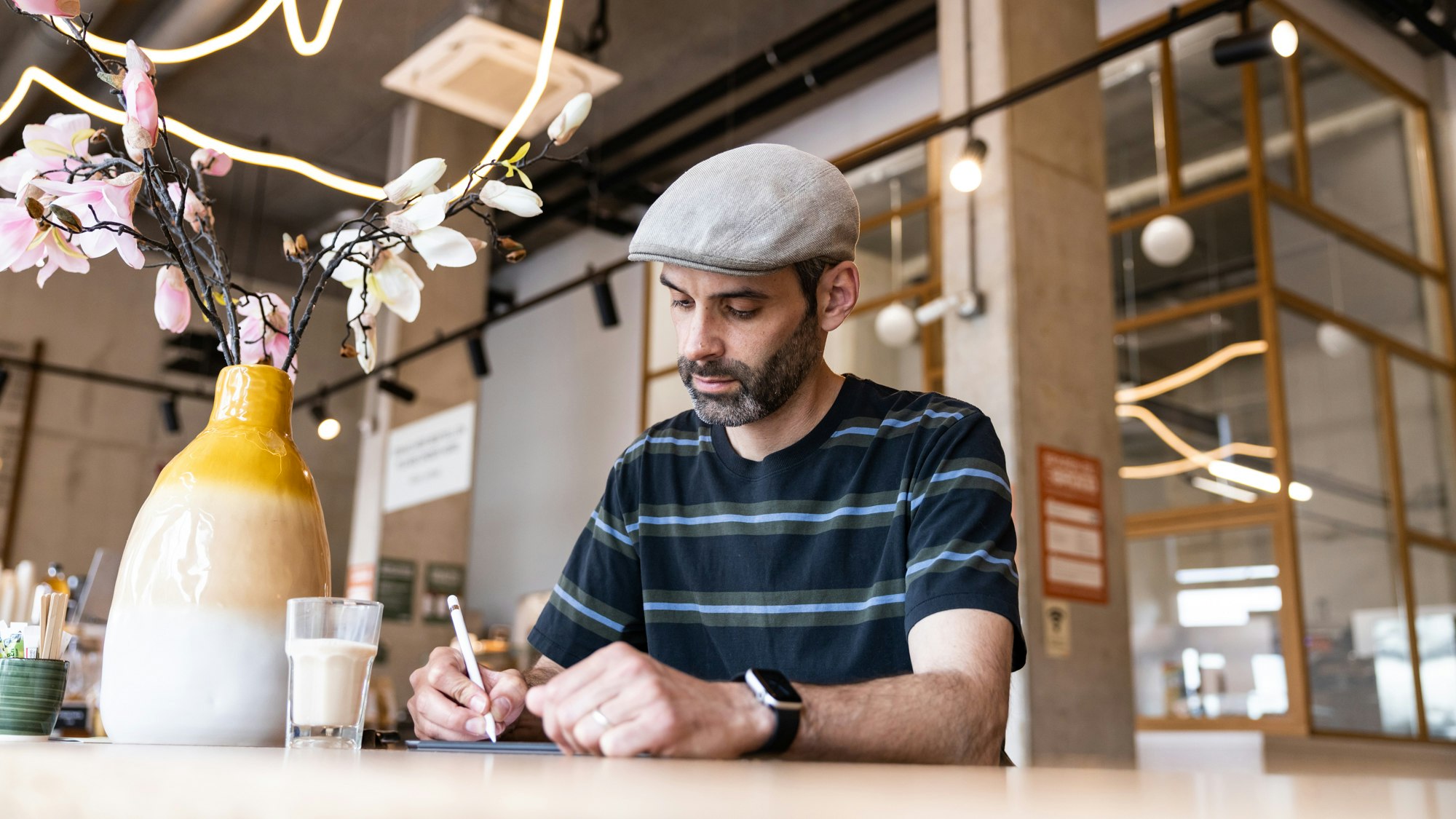 Marco Torrente sketching in a café.