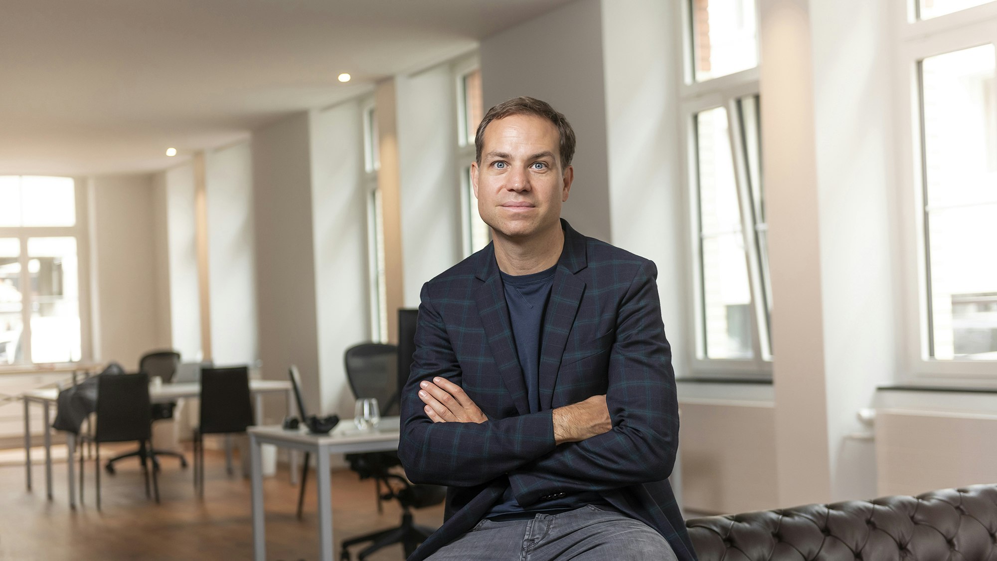 Tobias sitting in empty office