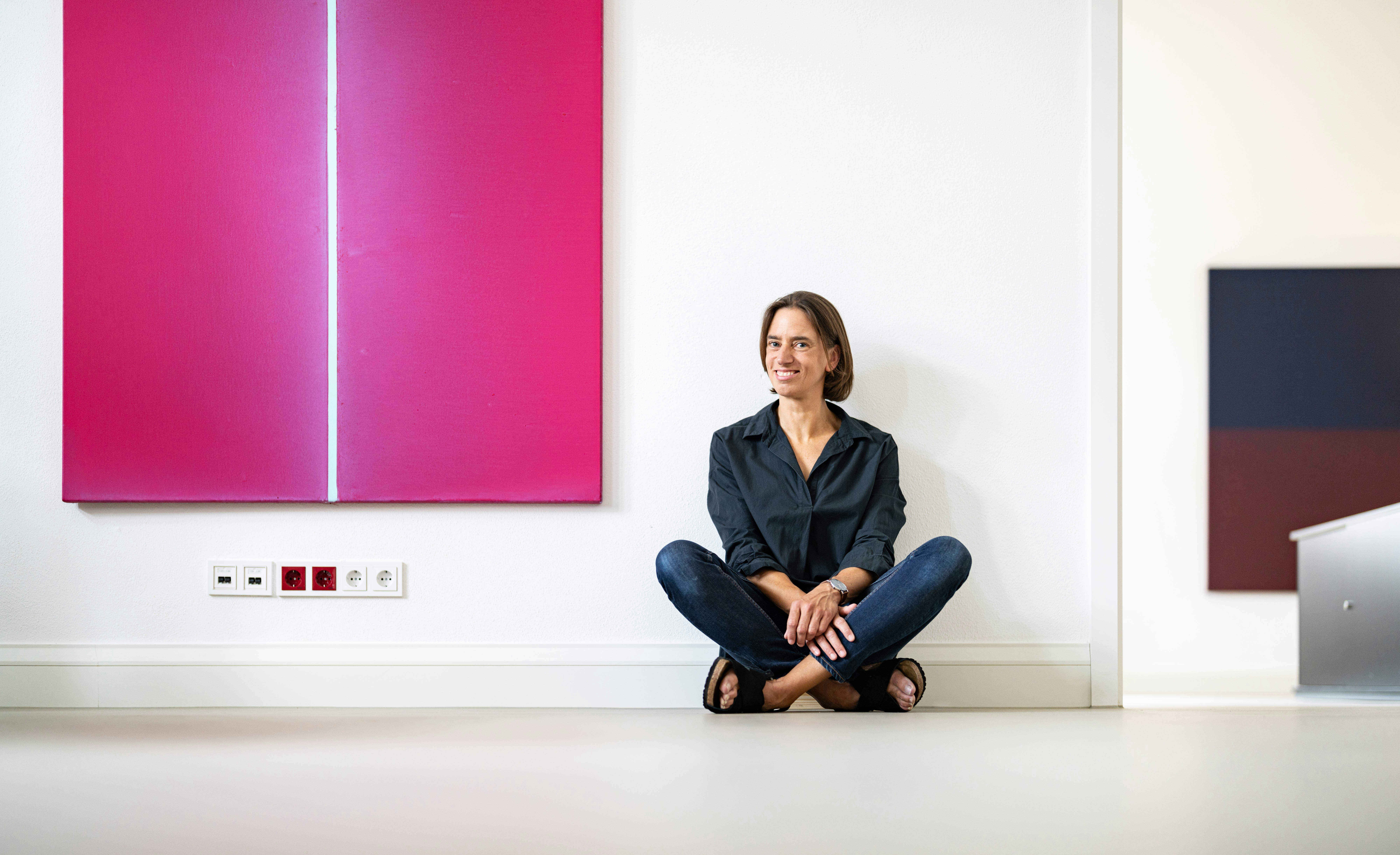 Woman sitting next to an Art