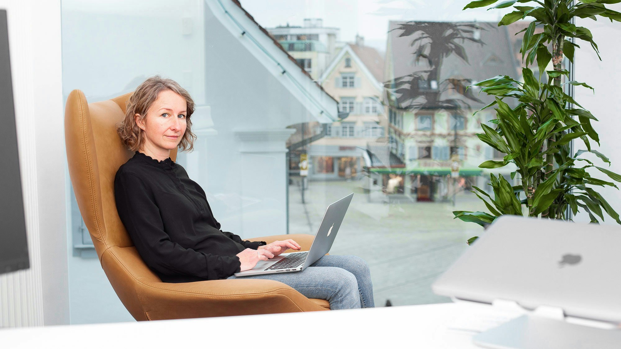 Employee with city in background