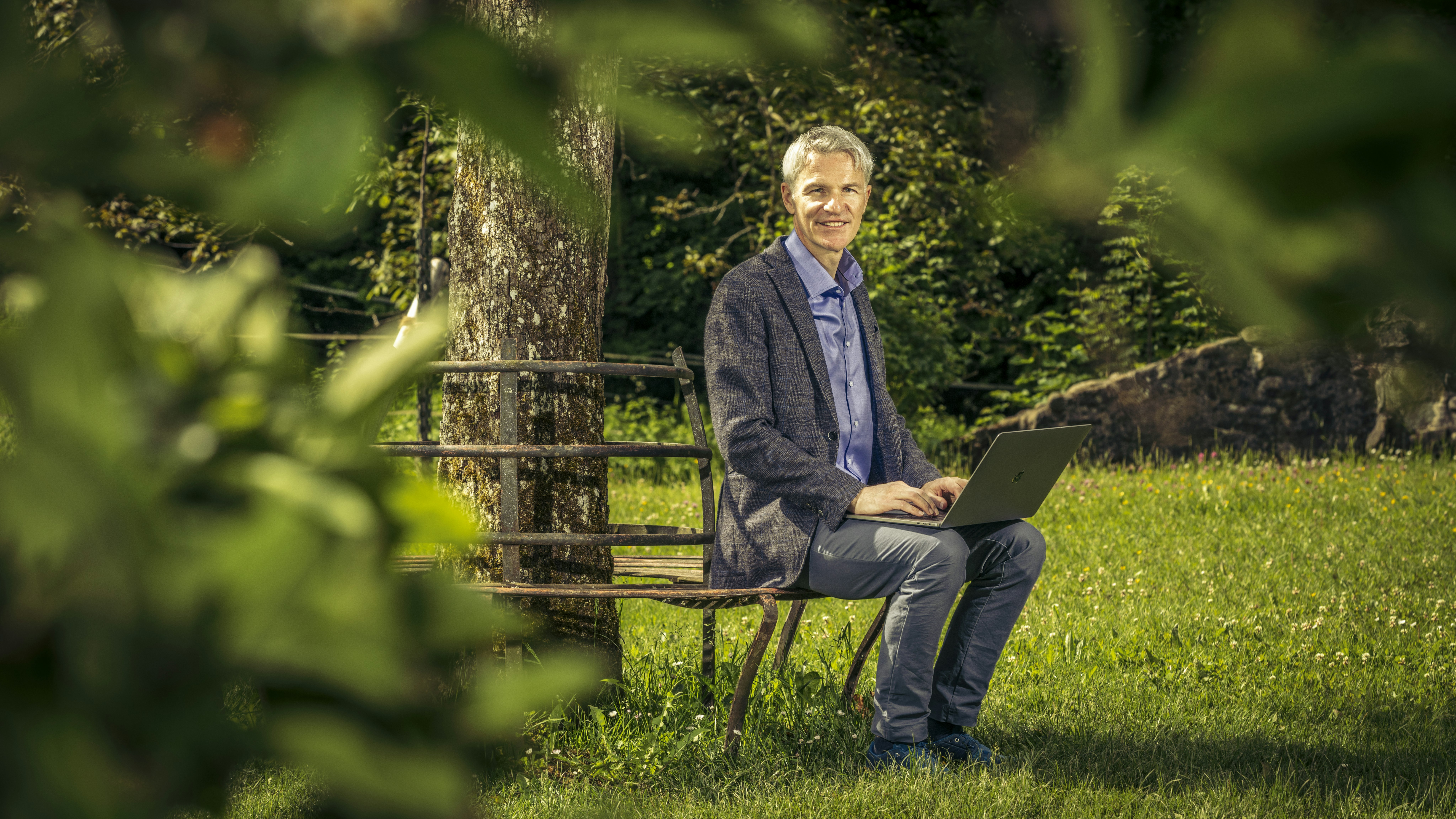 Sitting Male with laptop in nature