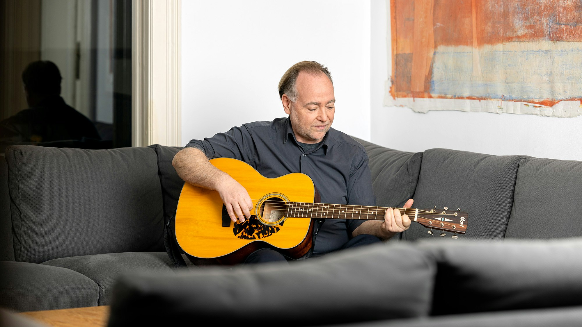 Eric plays on the guitar