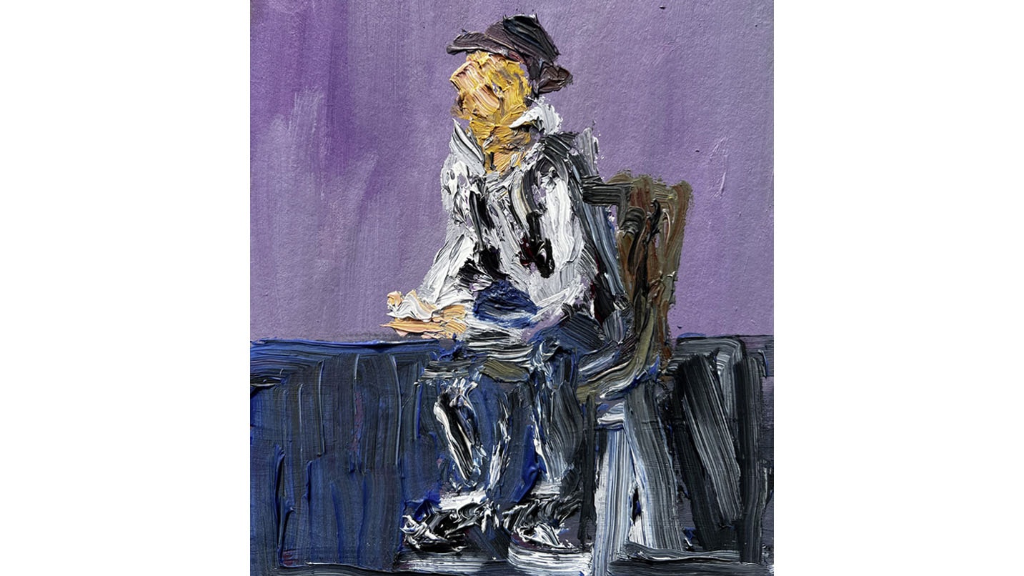 portrait of man sitting on a chair