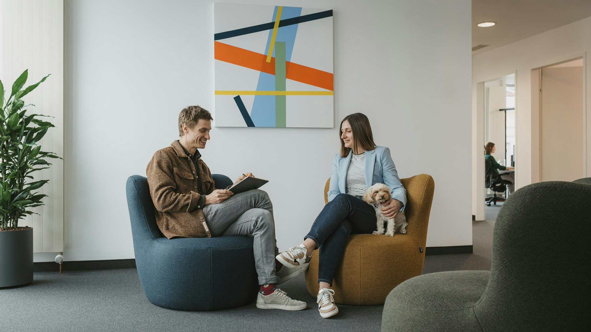 People in the office with artwork