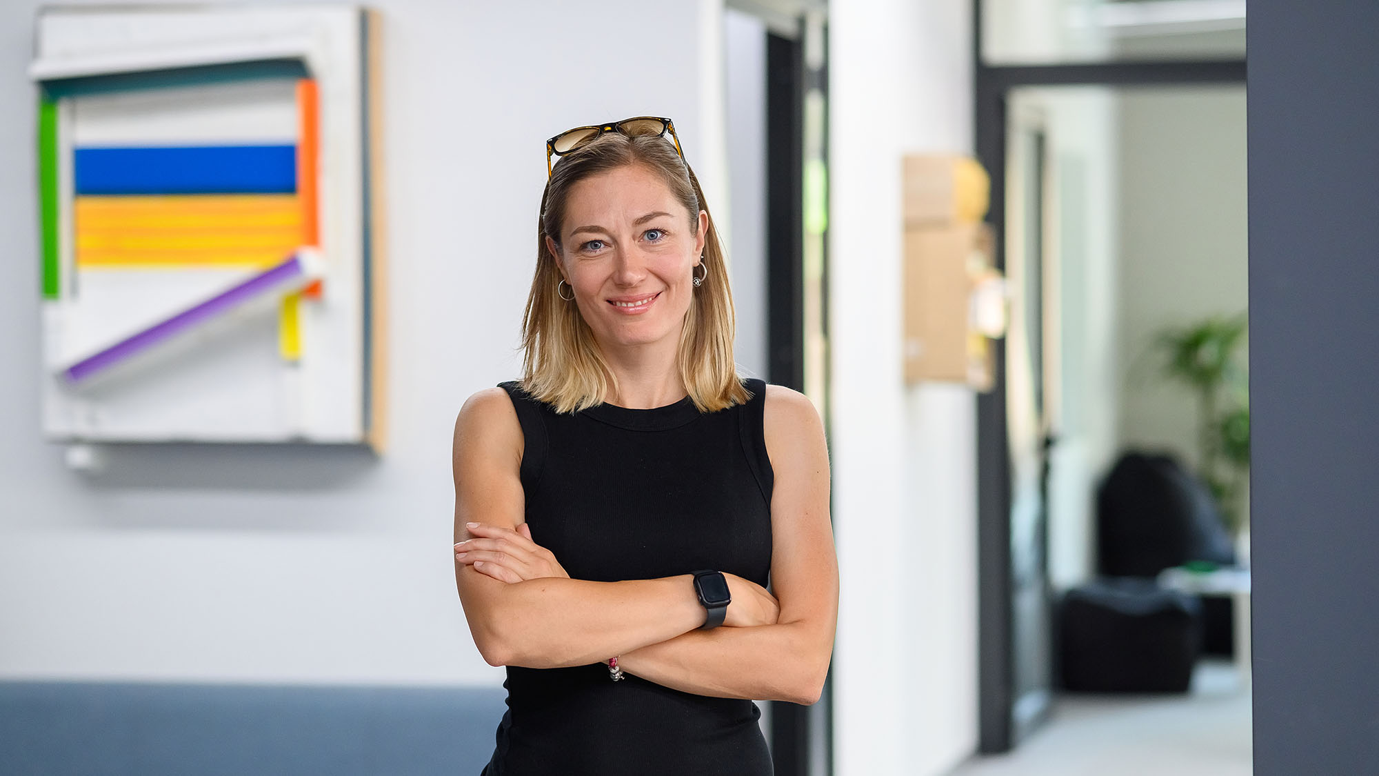 Woman standing in an office corridor