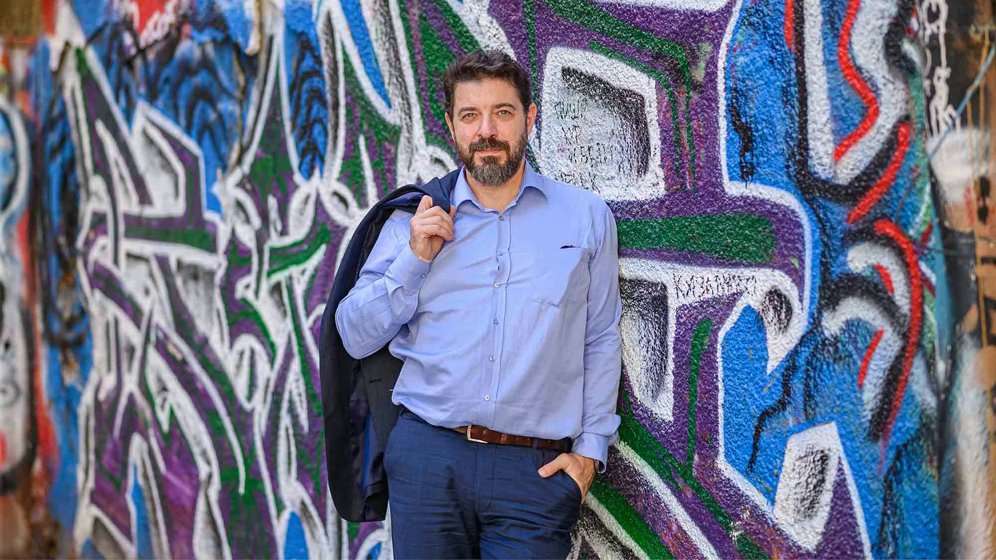 Person in front of graffiti wall
