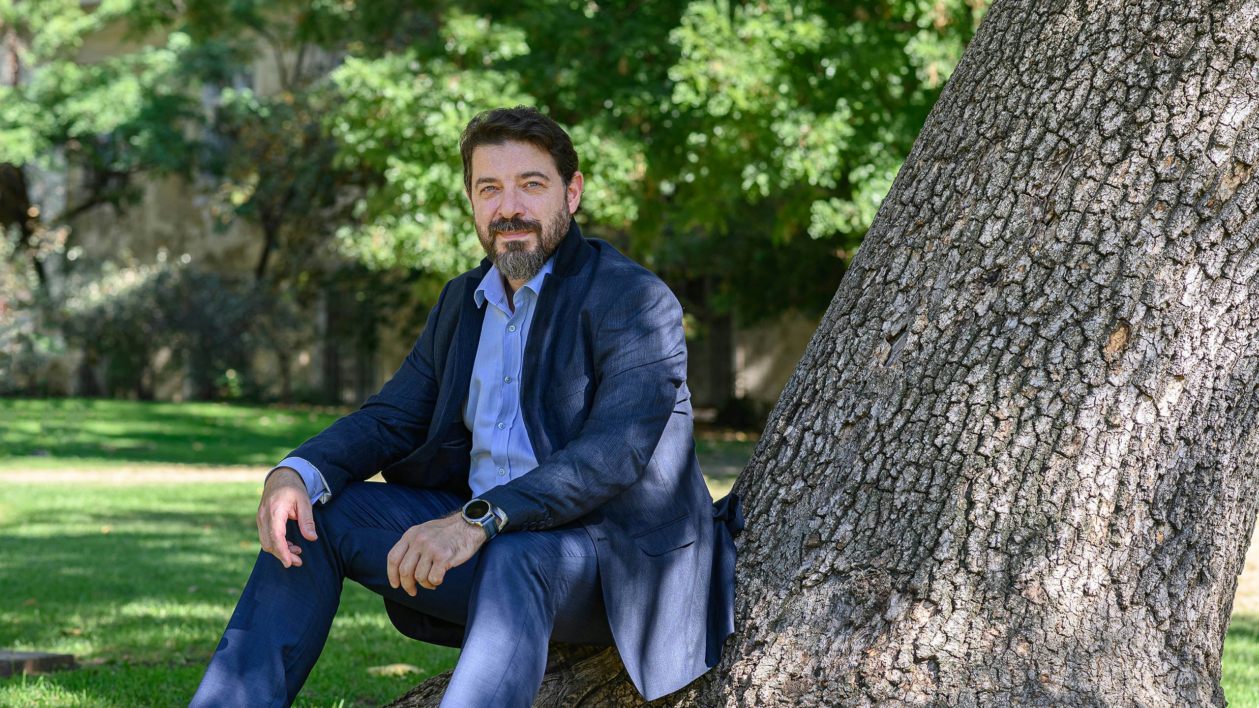 Person next to a tree