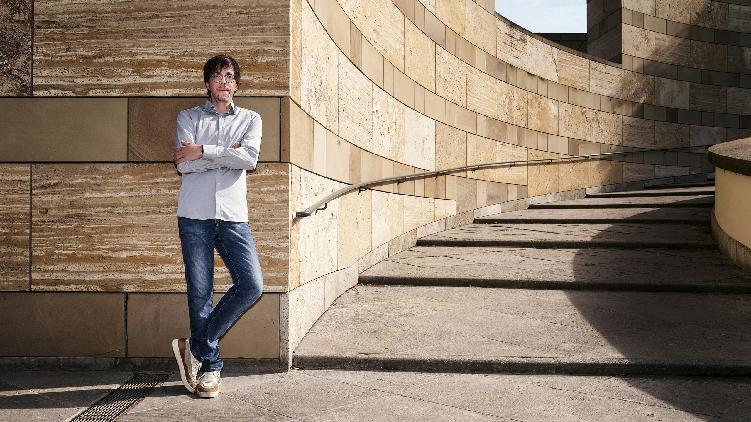 Johannes Erhazar leans against a wall.