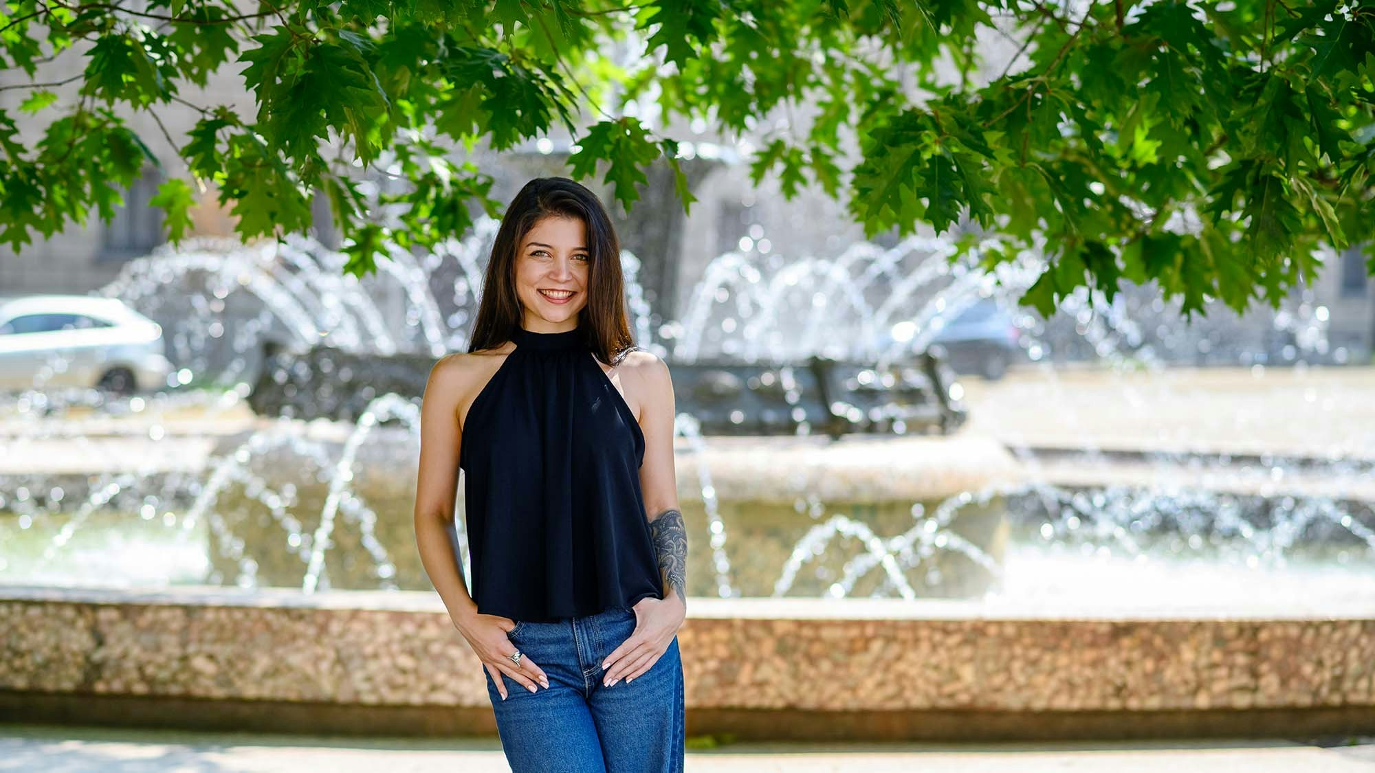 Employee near a fountain.