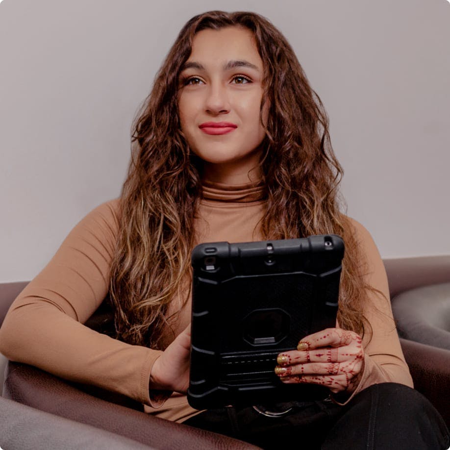 Patient filling out a digital form on a tablet.