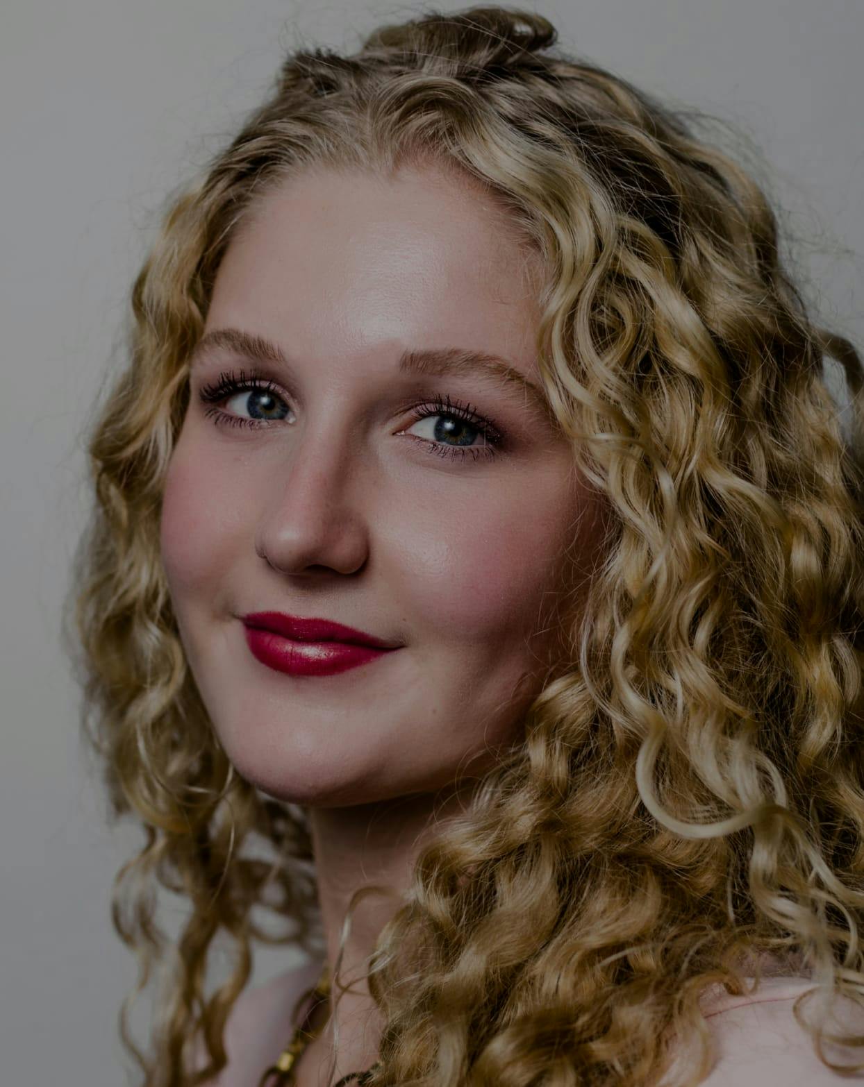 Closeup of a smiling woman.