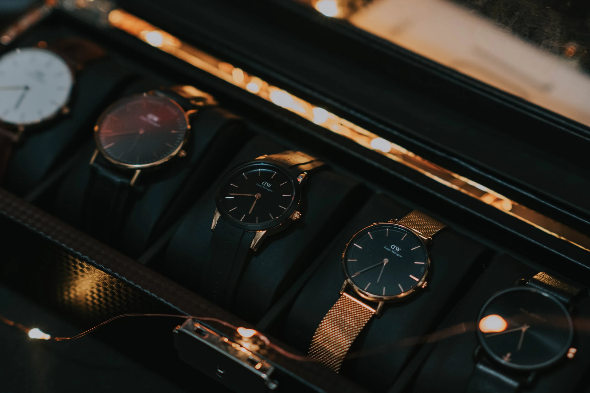Collection of 4 watches in a watch case