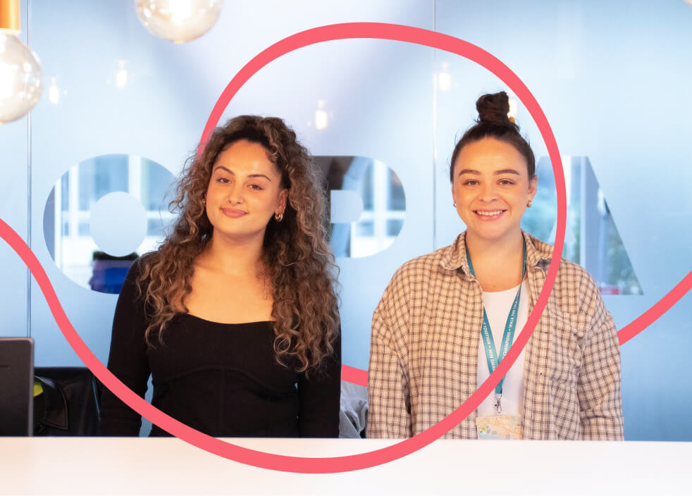 Two women smiling at the camera