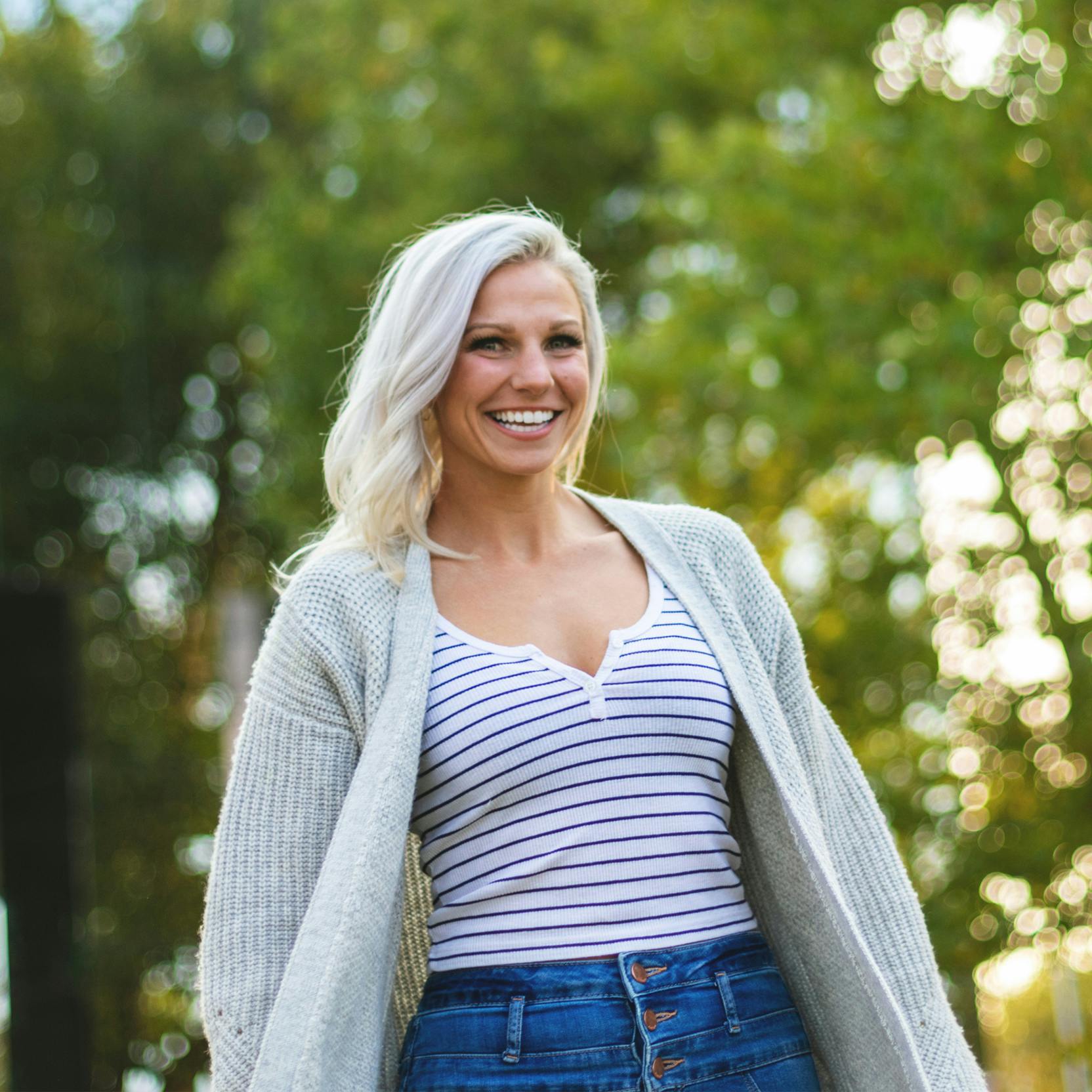 Woman smiling after a tummy tuck in Fayetteville