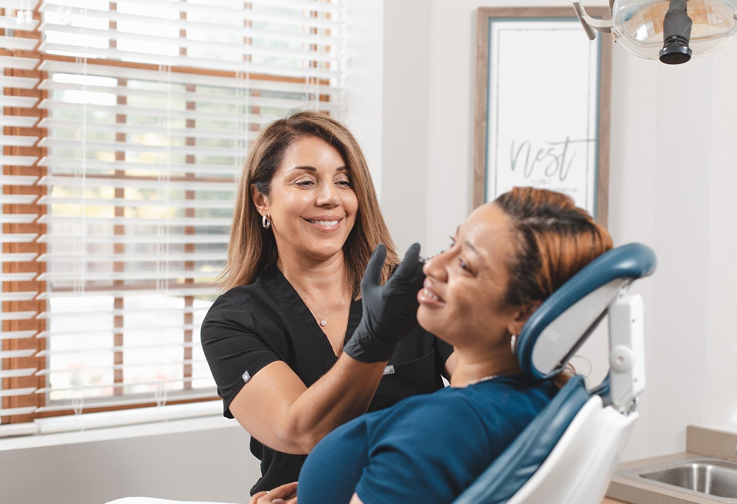 Woman getting facial treatment