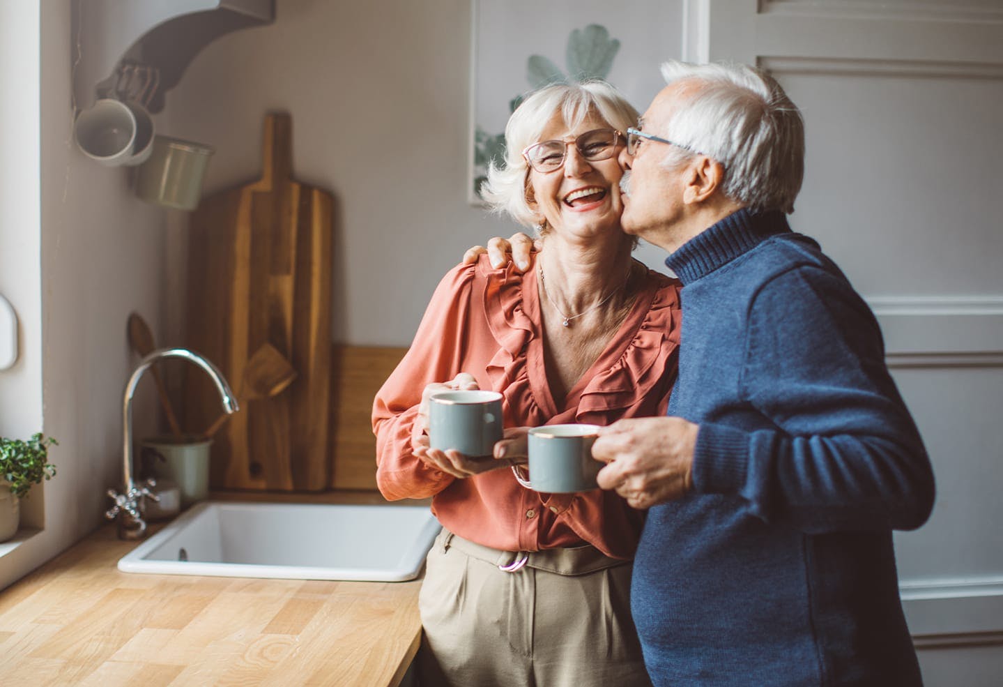 Man kissing a woman on the cheek
