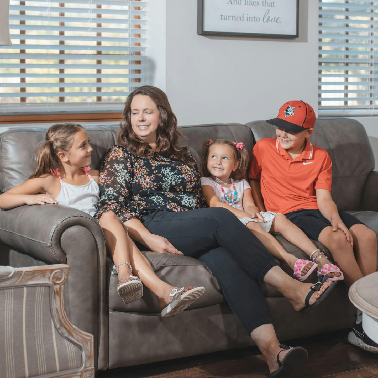 A family sitting on the couch at Ladone Family Dental Center