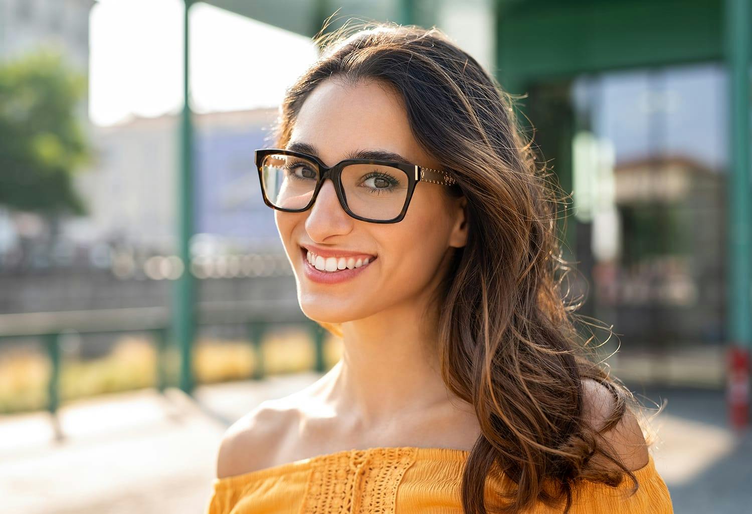 Woman in glasses and a yellow shirt
