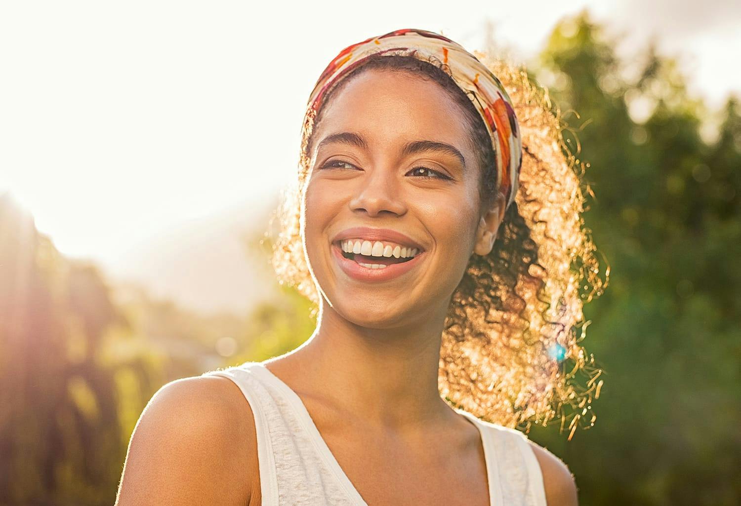 Woman with a headband and curly hair