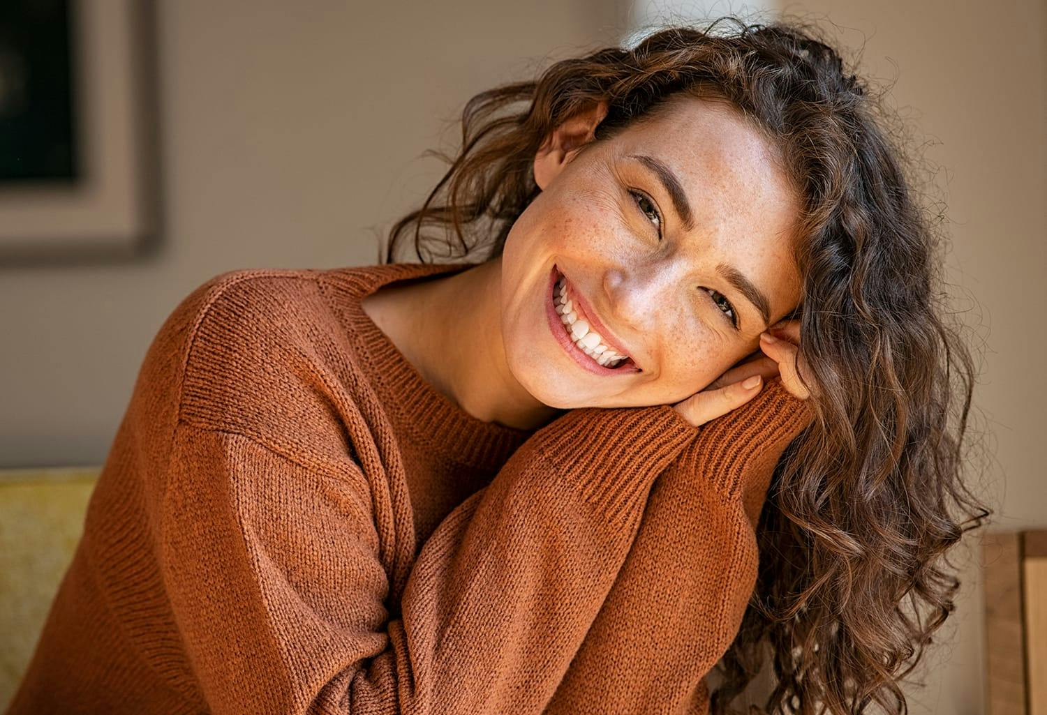 Woman in an orange sweater