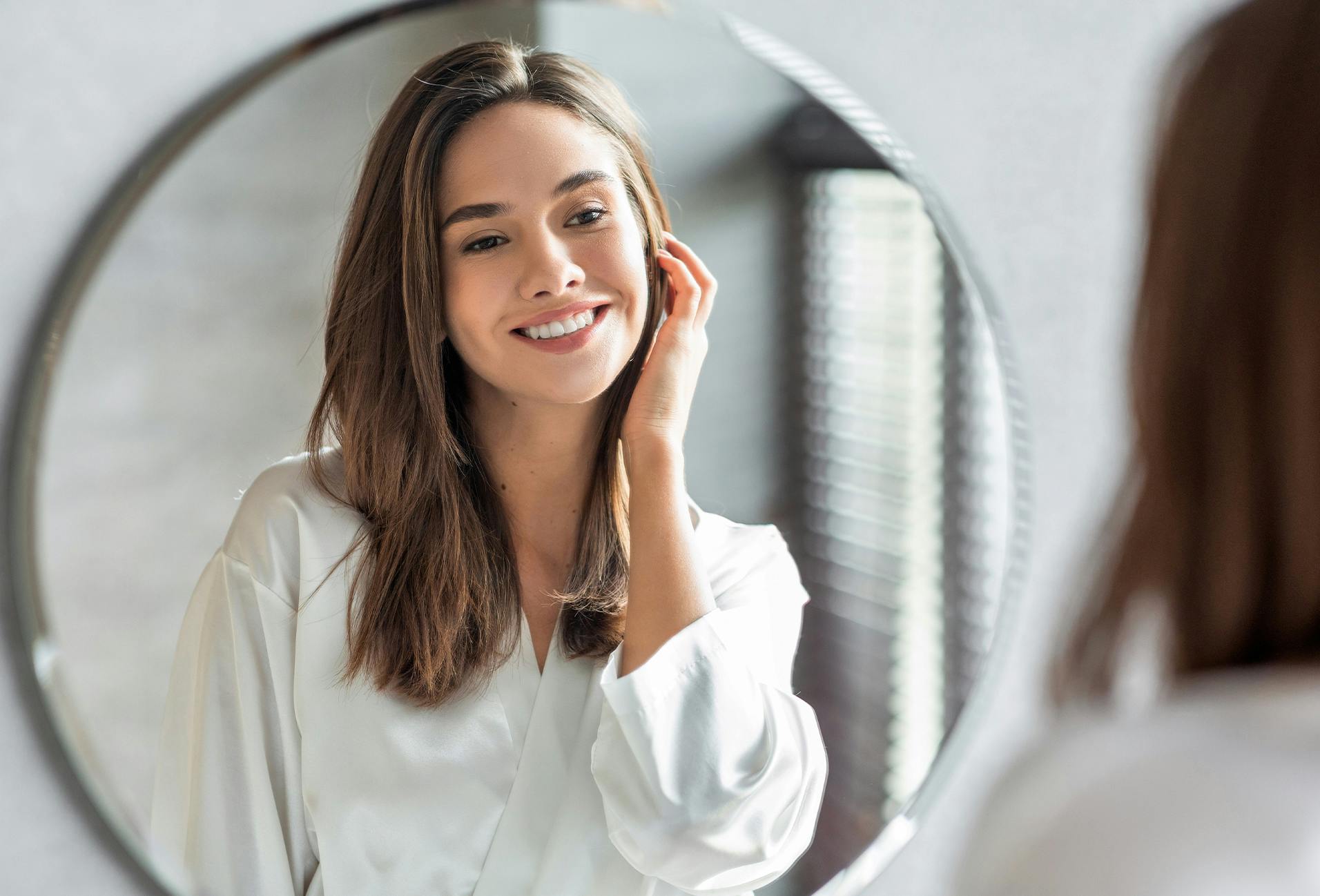 woman looking in a mirror