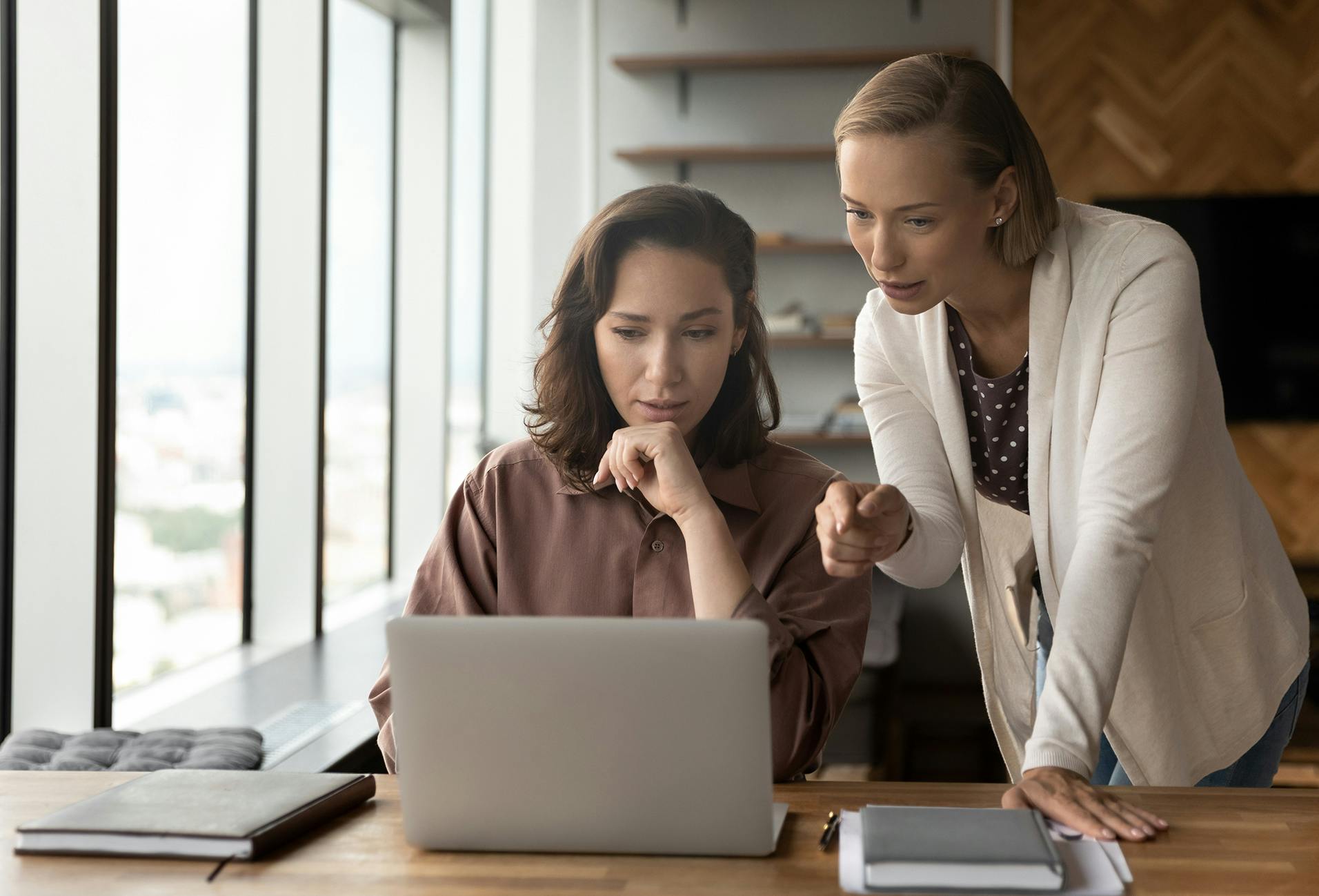 women looking at a laptop