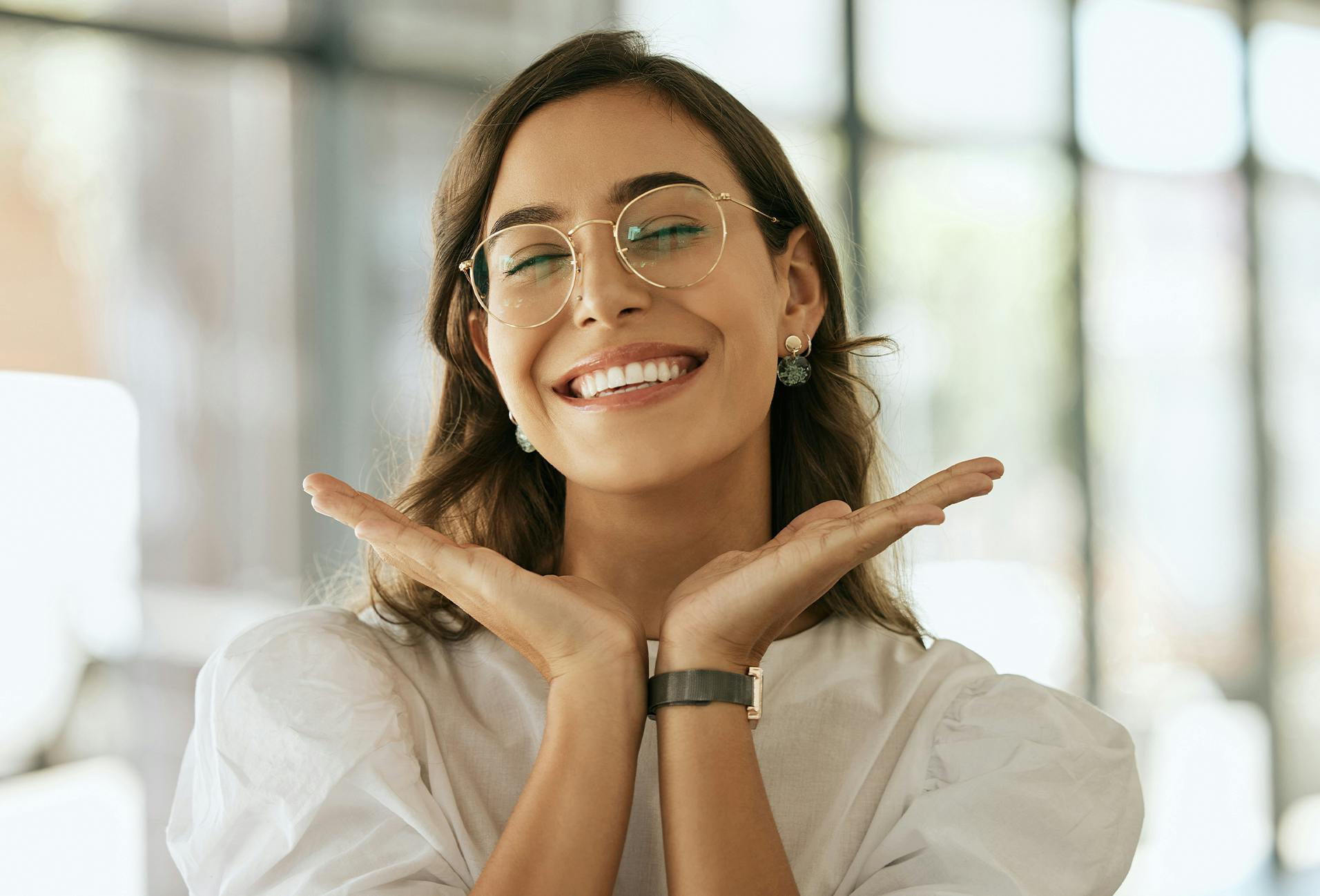 woman in glasses smiling