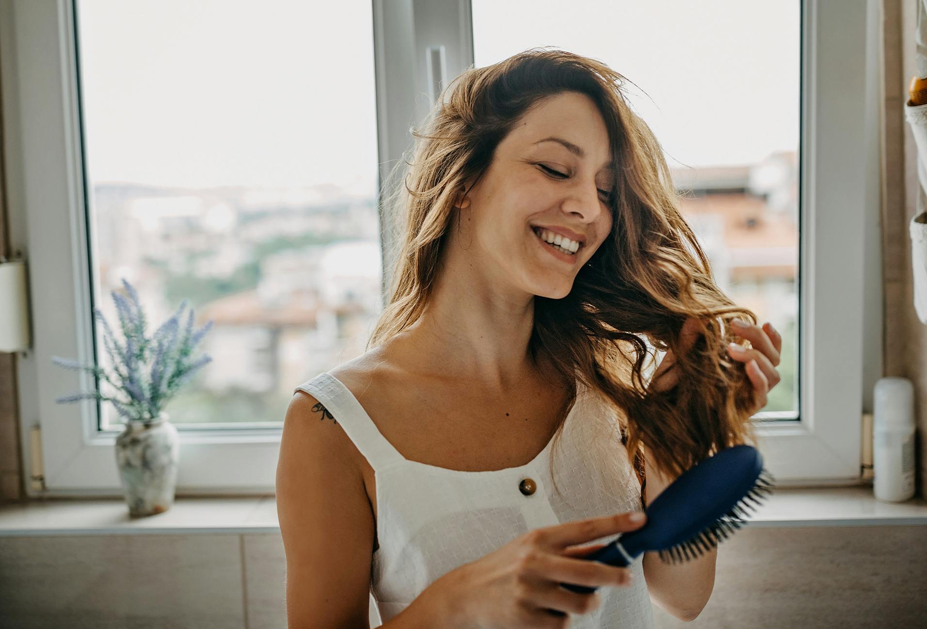 woman brushing her hair