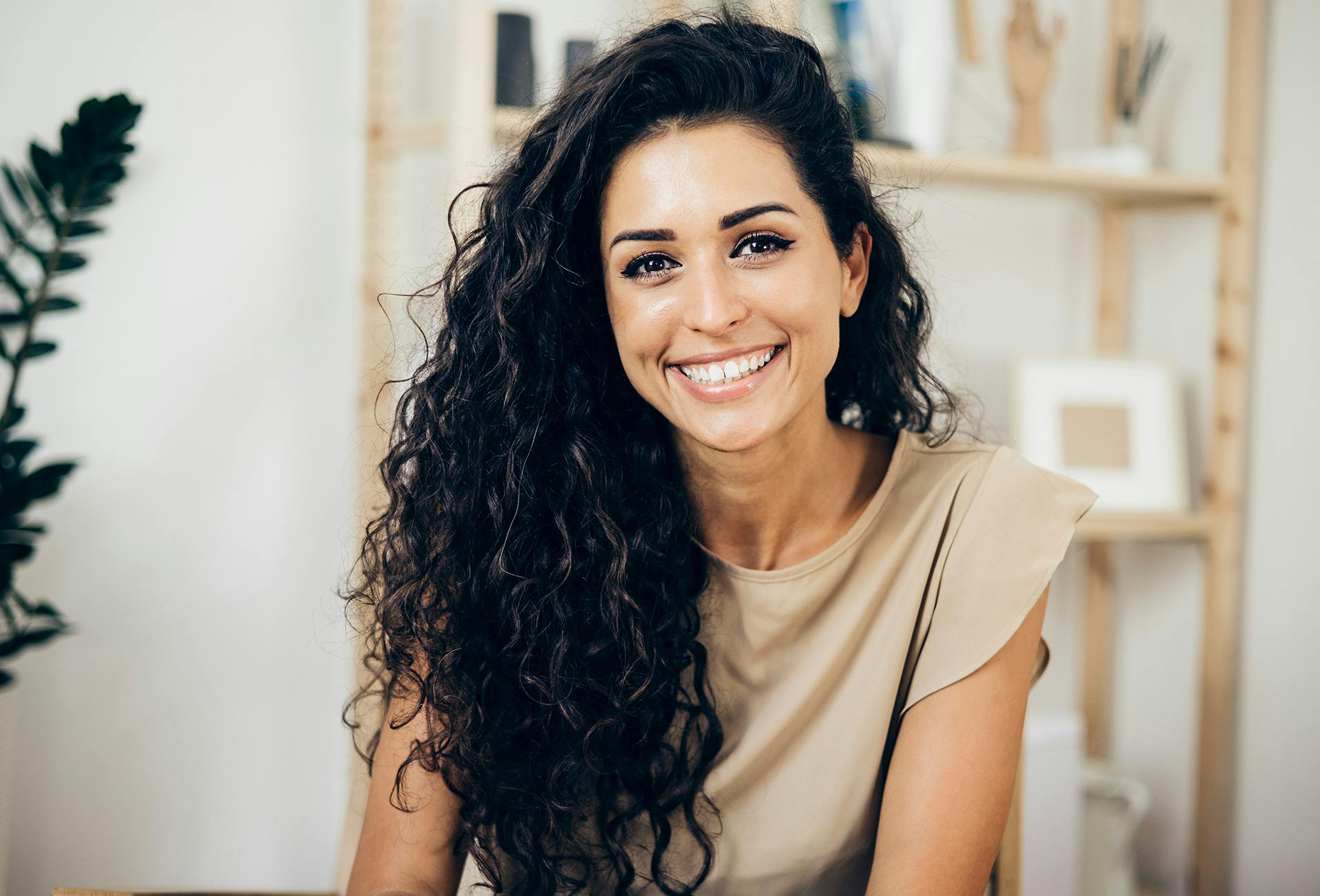 woman with long dark curly hair