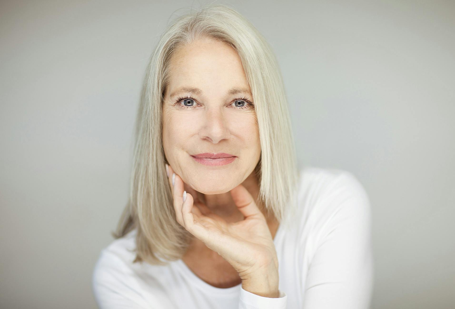 woman with shoulder length grey hair