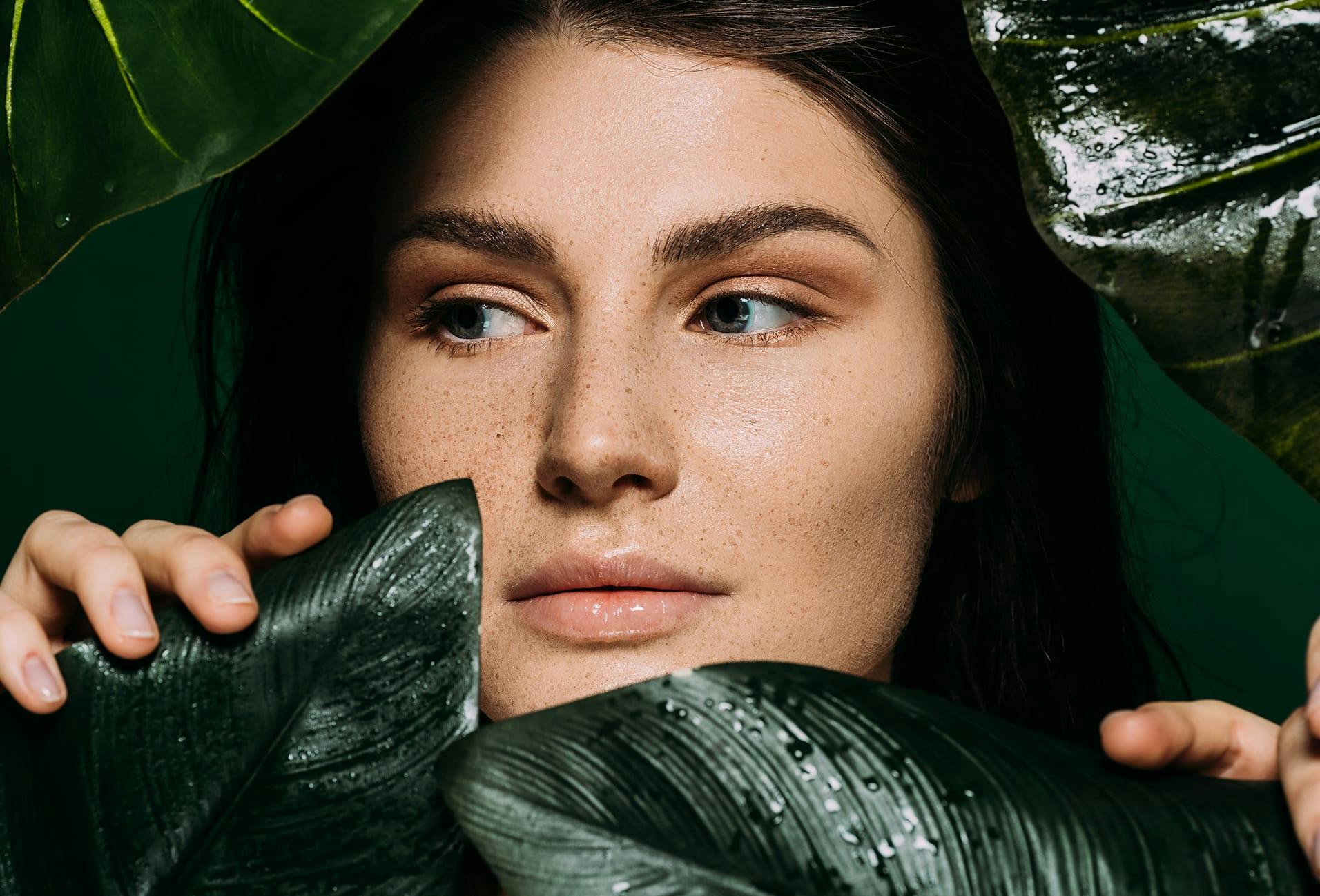 woman standing near leaves